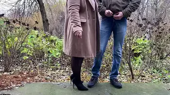 StepMother-in-law in leather skirt and heels holds son-in-law's dick while he pees