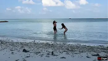 Busty stepmom and stepdaughter got golden showers instead of tanning on a public beach