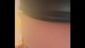 Tattooed brunette in leather lingerie does sexy dance, and has an orgasm while masturbating with a dildo