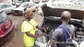 The mechanic and his clientele caught fucking publicly in a car garage in front of other clients with his big long cock in his work clothes on African Street thug