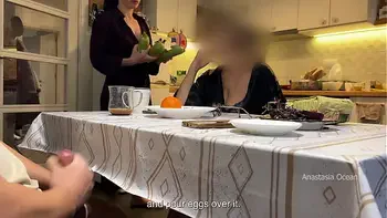 My husband jerking under a table front of my step mom and i right at the kitchen.