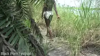 Skinny African tribe woman working outdoor
