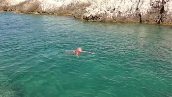 Blue water and a naked girl!