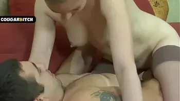 Hot MILF caught a young guy watching porn and fucked him passionately