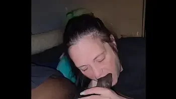 Mature cocksucker eats a black cock