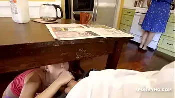 step Daughter sneaks under the table to suck daddy's cock