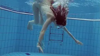 Hot naked girls underwater in the pool