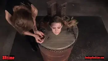 Bdsm babe trapped in a barrel and electrified