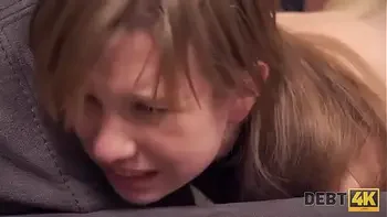 Debt4k. Red-haired miss reaches orgasm and returns the debt at the same time