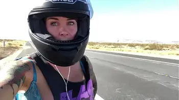 felicity feline riding on aprilia tuono motorcycle