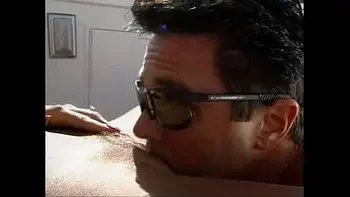 Busty lifeguard having fun on a boat.