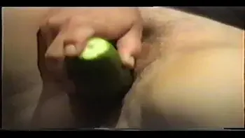 milf Joy with a cucumber