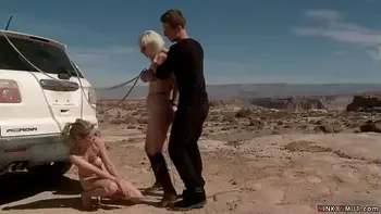Busty blondes hogied in a desert