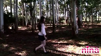 Lesbian nina fingers her pussy in the forest for her fans