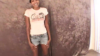 Slim amateur ebony teen fucks her pussy with a dildo in solo