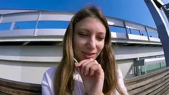 Talia Mint plays in public with remote control toy over the phone with fan