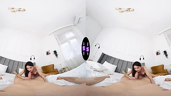 A long-haired brunette with natural tits fucks in missionary position