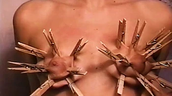 Horny dude loves putting clothes pegs on his slaves tits
