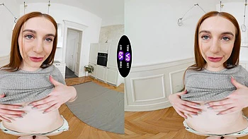A sexy girl with long hair plays with her pussy in shorts