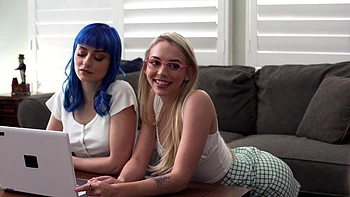 Two hot girls share a big cock in an intense threesome scene