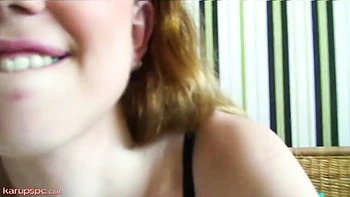 Long-haired blonde Daphne Rush sticks a dildo in her shaved pussy