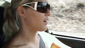 Good outdoor posing session on the beach with a busty Sophie Moone