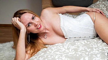 Beautiful hottie Mamie nicely plays with her hungry shaved pussy