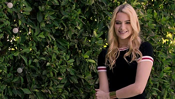 Two hot blondies share a big cock in an intense threesome scene.