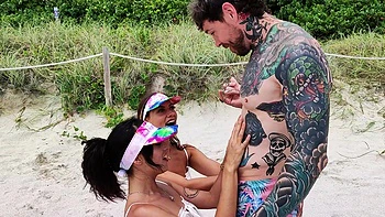 Four sexy people have a great fun on the beach with dan