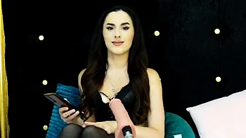 Sexy brunette babe in lingerie and stockings toys pussy