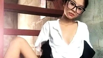 Asian teen plays with toys on webcam