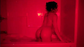 Latina babe masturbates solo in bathtub