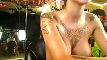 Tattooed Chinese Filipina babe oils solo pussy play