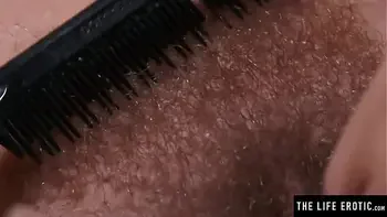 Watch this cute brunette soap up her hairy pussy in the shower