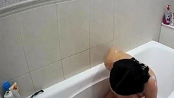 Busty brunette masturbates solo in shower