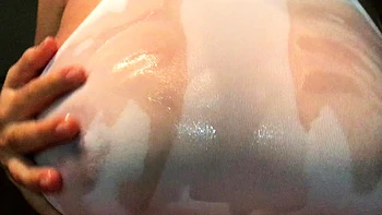 Big boobed Memphis masturbates in a bodystocking