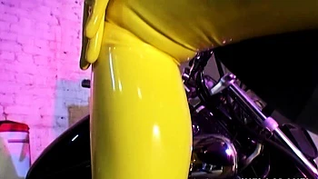 Latex lesbians pleasing their holes